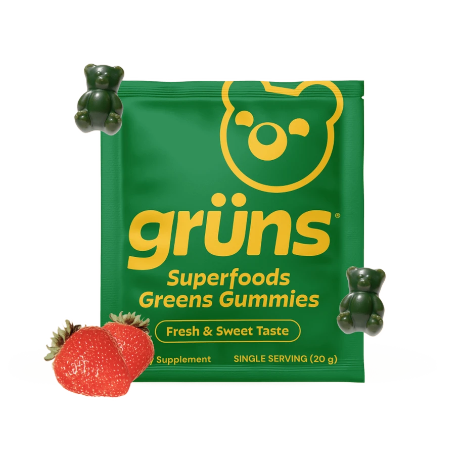 Grüns gummy pack surrounded by taped-up fruit and veggie cutouts